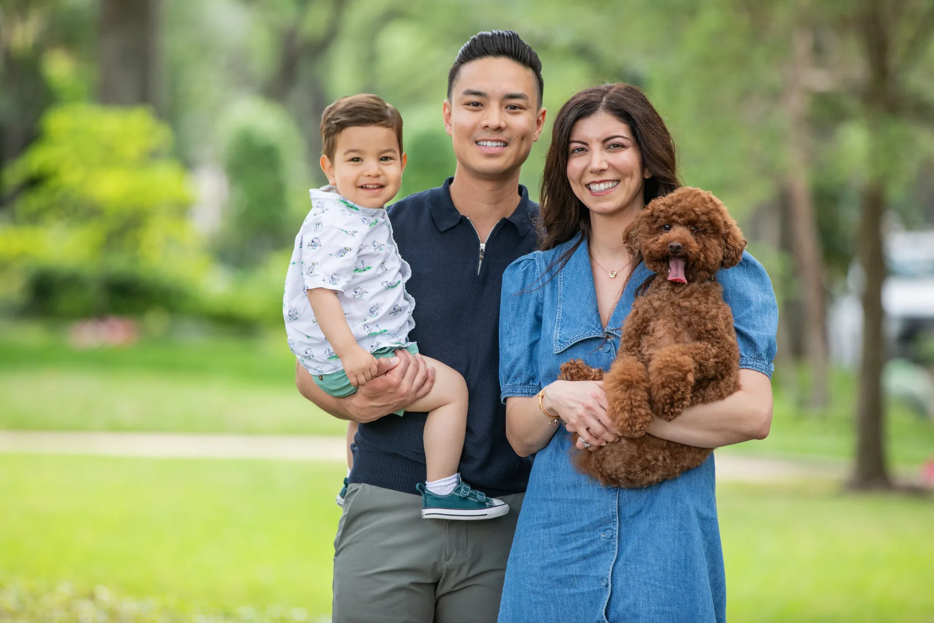 Dr. Lina and Dr. Tim with their son and dog